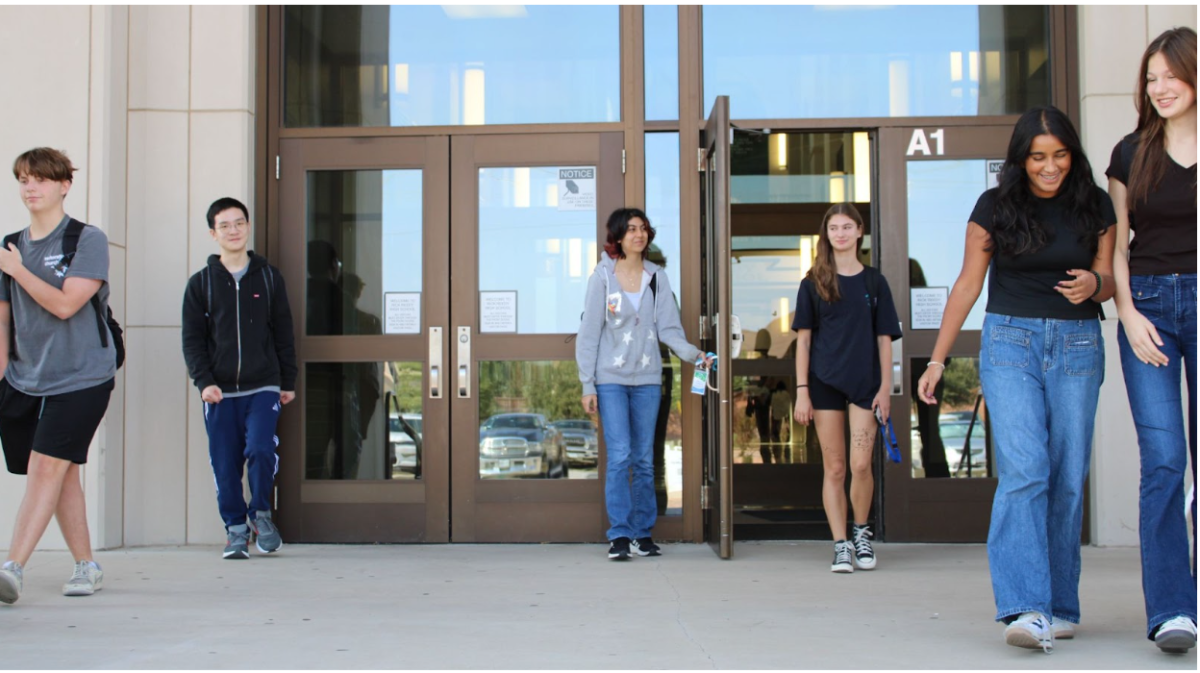 Six Reedy High School students leaving school. These and many other students got to leave an hour and a half ahead of time with early release.